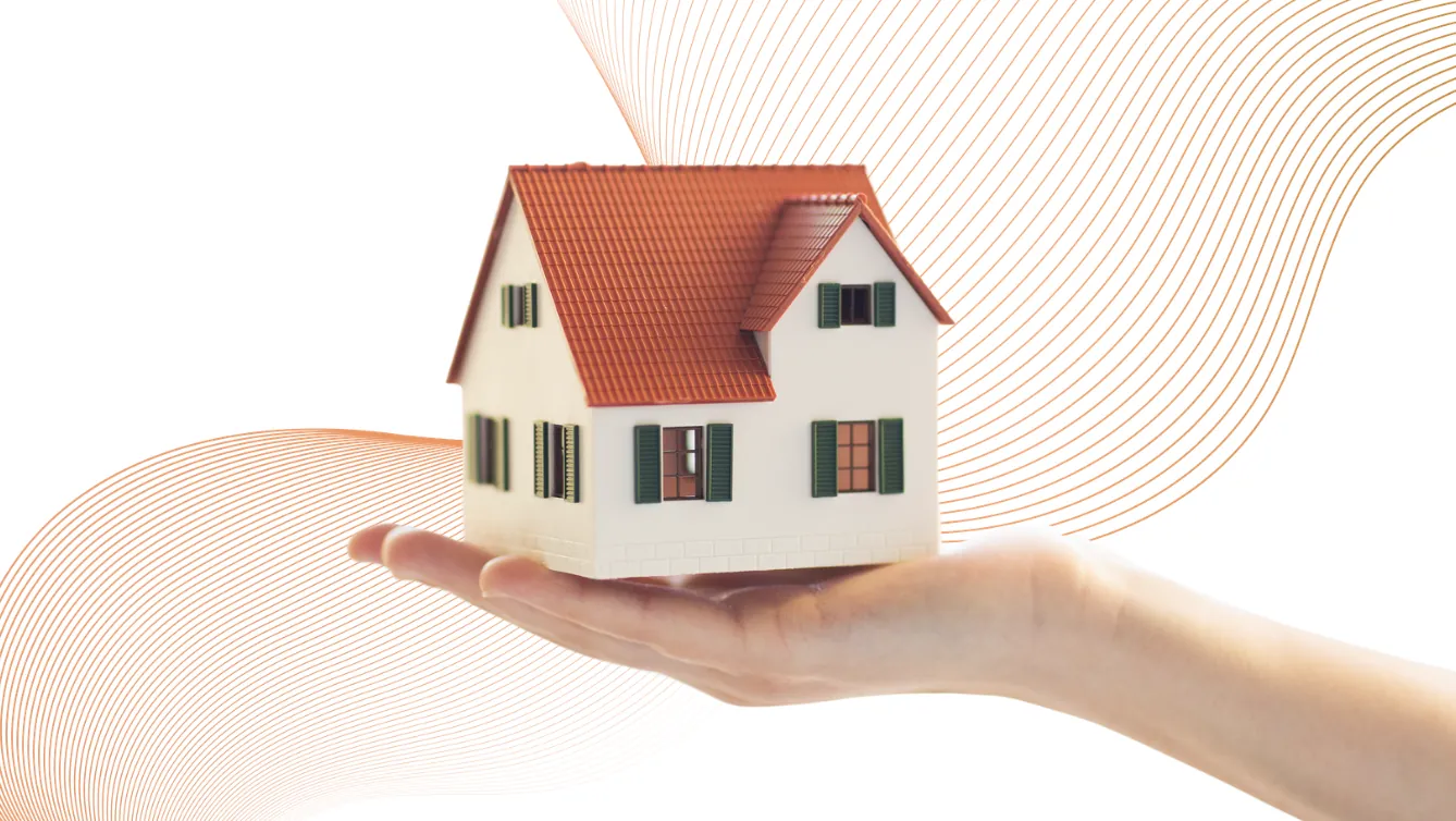 A hand holding a miniature house with ROQAD's orange identity waves sweeping behind it.